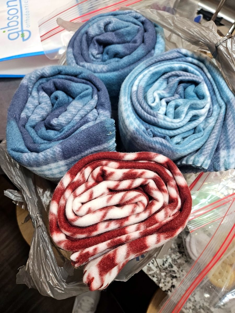 Rolled fleece blankets ready to be given out