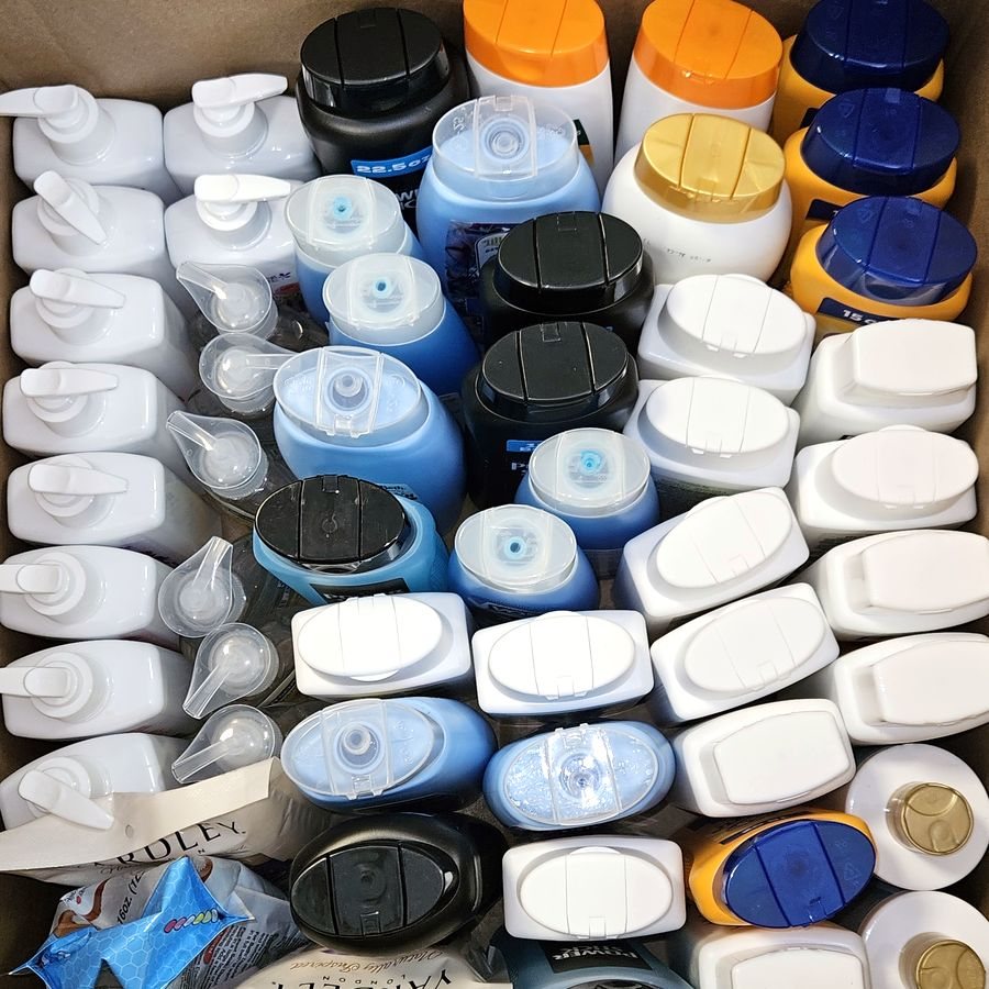 A box of body wash and lotion bottles