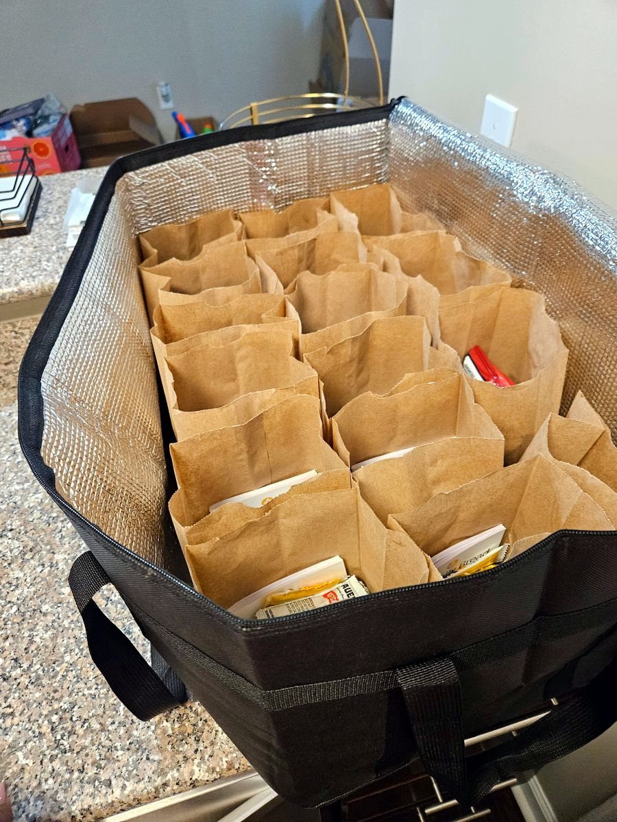 Sack lunches packed in an insulated carrier