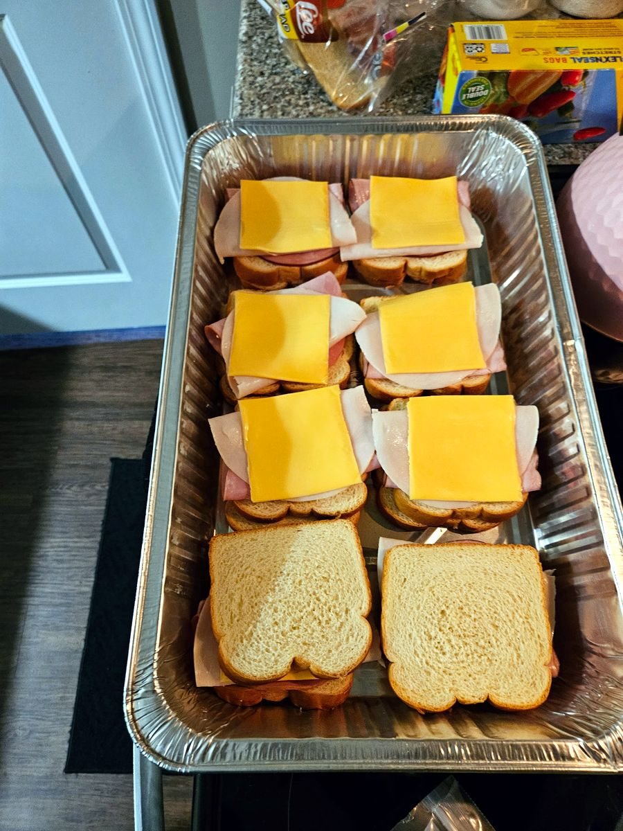 Sandwiches being assembled for sack lunches